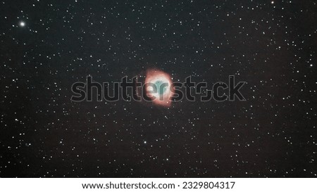 This object, called the Helix nebula, lies 650 light-years away, in the constellation of Aquarius.