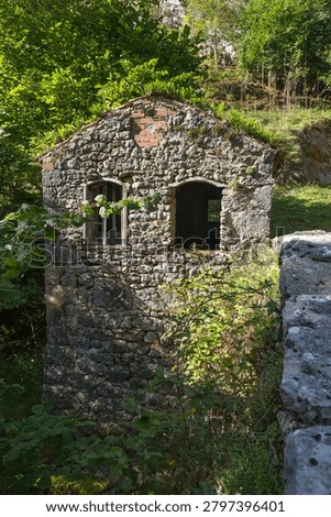 This old, abandoned mill is located in the Rio Duje Valley in the Picos de Europa in Asturias, Spain. The valley is wonderful for hiking and runs alongside the Duje River. An old, arched stone bridge crosses the creek. 