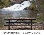 this old picnic table sits at the shore of 12 foot falls county park in marinette county, Wisconsin, united states, north America, northern hemisphere