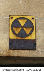 This Old Rusty Fallout Shelter Sign Is A Relic From The Cold War, It Guides To The Netrance Of A Bomb Shelter Offering Protection Against A Nuclear Attack By The Russians During The Cold War.