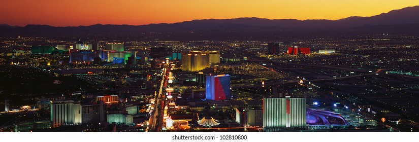 This is an older aerial view of the strip showing an overview of the whole Las Vegas area at sunset.
