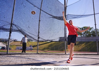 This Ones A Record Breaker. Shot Of A Young Sportsman Throwing A Discus.