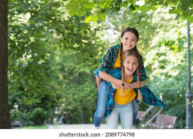 This Is Our Time. Positive Models. Casual Hipsters Outfit. Portrait Of Happy Sisters. Small Kids Girls In Shirt. Two Funny Smiling Hipster Girls In Trendy Summer Clothes. Carefree Kids Posing Outdoor