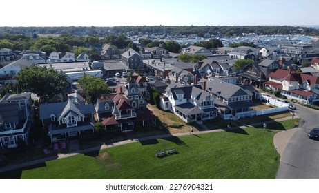 This pack of photos showcases the picturesque Oak Bluffs Ocean Park on the Island of Martha's Vineyard. The photos capture the park's natural beauty, including its lush green grass, towering trees, ro - Shutterstock ID 2276904321