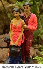 This is a pair of a boy and a girl which is a figurine made of plastic
