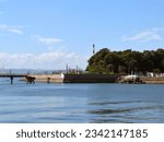 This is a parnoramic view of the breakwater and embankment at a fishing port.
Beyond them, there is the Mizushima Industrial Area in haze,
which is a landmark of Western Japan.
