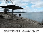 This is a part of a series of photos that I shot at Lake Waco in Waco Texas. This was all in Reynolds Creek Campground. This is a lakefront picnic area with a table, BBQ pit, and awning.