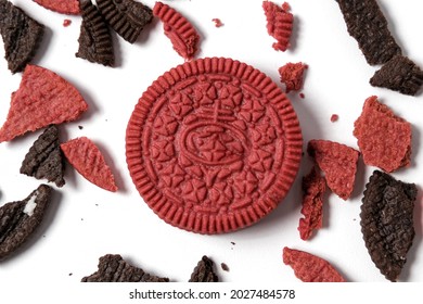 This Is A Photo Of Chocolate Cookies And Velvet Oreos On A White Background With Oreo Crumbs Around It With A Pattern Concept