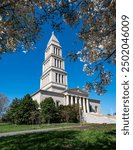 This is a photo of the George Washington memorial in Alexandria,VA.  Taken druing the morning of the Cherry Blossom Peak, it has the building and cherry blossoms overhead. 