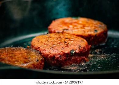 This Is A Photo Of Some Fire Cooked Vegan Burgers.