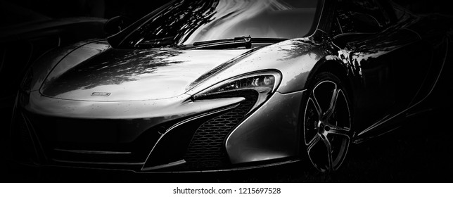 This photo was taken at Beaulieu, Hampshire / United Kingdom - August 25th, 2015: Silhouette of the front of a Mclaren 650S super car