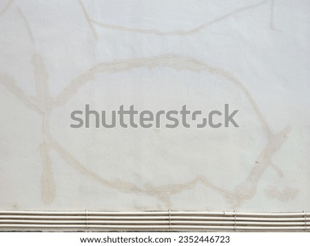 This photo was taken on a light brown wall. The background is a crack. And there is a repair, filling, new paint. Below is a PVC pipe. that uses tap water pipes. This image can be used as a background