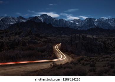 This Is A Picture Of Alabama Hills At Night With Car Light Trail At Lone Pine, CA, USA.