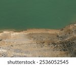 This picture is called "Gandalf in Middle Earth".
The Baton positioned in the middle of the white and black pebbles makes me think of Gandalf in middle earth, between good and evil. Ganguise Lake. 