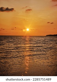 This picture is a great example of the sunset reflection on the ocean. The orangey color of the sunset reflects off of the water and makes it look like the ocean is glowing!