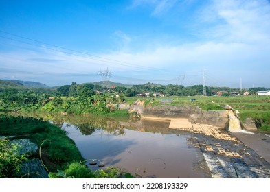 In This Picture, The River Flow Looks Like There Is A Water Barrier Or A Dam