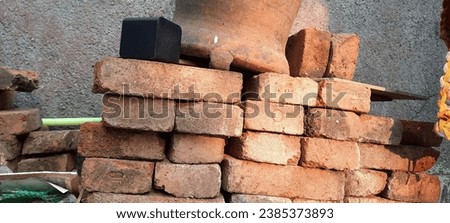 This pile of bricks has been salvaged from the ruins damaged by last year's earthquake. Fortunately, these bricks are still in reusable condition