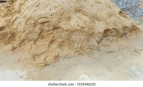 This Is A Pile Of Sand That Is Poured On The Floor. To Be An Ingredient In Various Construction Materials