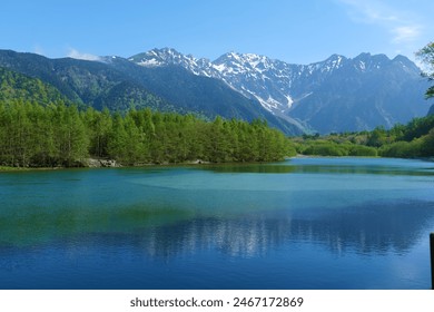 This place is Taishoike pond in the Chubu Sangaku National Park.Matsumoto,Nagano,Japan.Late May. - Powered by Shutterstock