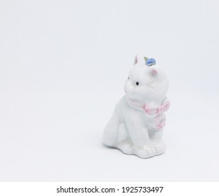 This Porcelain Souvenir Cat Looks Adorable 