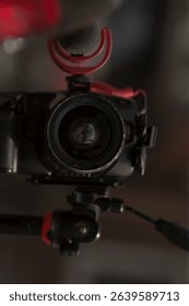 This professionalgrade camera mounted securely on a sturdy tripod, paired with a highquality microphone, is the ideal setup for a wide variety of photography and videography projects
