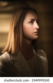 This Profile Portrait Photograph Shows A Young Professional Woman Looking Off Into The Distance.