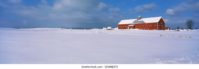 This Is A Red Barn In The Snow. It Is Representative Of Winter In New England.