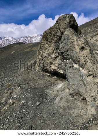 This rock the combination of sedimentary rock and chert make it dark sand-like appearance. The picture is taken on a 3000m altitude on a top of mountain in Khaplu Town (2600m).