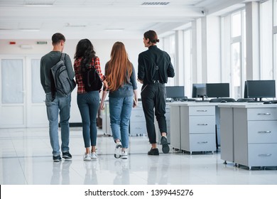 This Room Will Be Empty Soon. Group Of Young People Walking In The Office At Their Break Time.