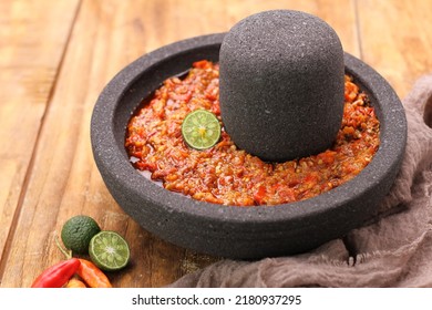 This sambal comes from Minangkabau. The chili for this sauce is steamed half-cooked with garlic, shallots or onions, and tomatoes. Then crushed coarsely and given lime juice and salt and fried briefly - Powered by Shutterstock