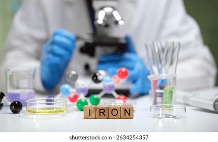 This scientific research setup includes elements such as iron, molecular structures, and assorted laboratory equipment