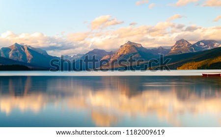 This serene lake image was taken in Montana at beautiful Lake McDonald. This is perfect to decorate your office or home.