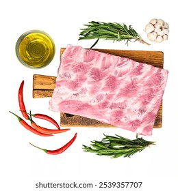 This setup features fresh pork belly displayed on a wooden cutting board with herbs, red chili peppers, garlic, and a bowl of olive oil, ideal for preparing a delicious m Isolated on white background - Powered by Shutterstock