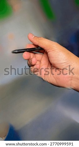 This shot captures the simple elegance of a mundane object and a human gesture, turning a 