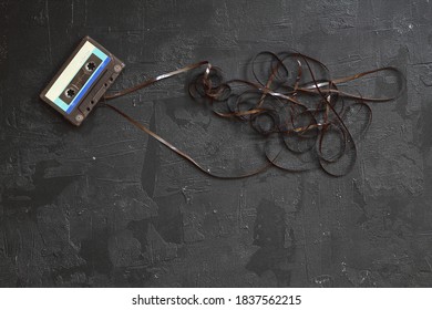 This shows a well known problem with the old fashioned compact cassettes: the tape used to come out, making the cassette useless