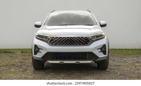 This silver crossover SUV blends style and performance with a bold front grille and LED lights