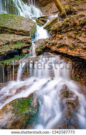 This is a small part of Machine Falls waterfall near Tullahoma, Tennessee. It is a long exposure shot to smooth out the water. This is a natural waterfall that falls probably 50 to 60 feet.