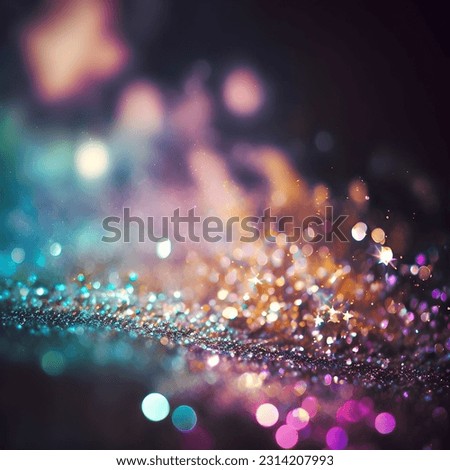 This stock photo features a blue and yellow background covered in glitter and featuring a bokeh effect