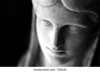 This stone face is from a four inch high statue. I used a macro lens.