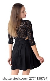 This striking image features a young woman from behind, showcasing an elegant black lace dress with three-quarter sleeves and a subtly revealed open back. Her long, flowing brown hair cascades down her back, and she subtly turns her head to look over her shoulder, revealing a hint of a thoughtful or curious expression and vibrant pink lipstick. The classic black attire contrasts beautifully against the crisp white background
