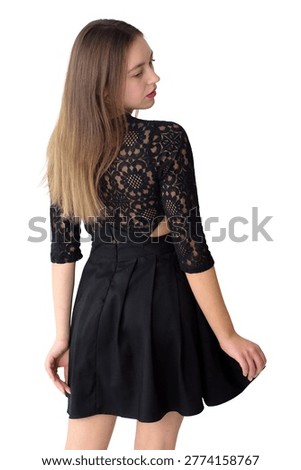This striking image features a young woman from behind, showcasing an elegant black lace dress with three-quarter sleeves and a subtly revealed open back. Her long, flowing brown hair cascades down her back, and she subtly turns her head to look over her shoulder, revealing a hint of a thoughtful or curious expression and vibrant pink lipstick. The classic black attire contrasts beautifully against the crisp white background