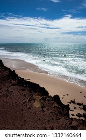 This striking image represents a bit of the world with humans. Showing a broad Ocean and a beautiful landscape. Pipa-RN-Brazil. 