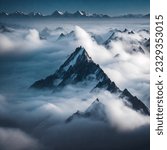 In this striking image, a towering mountain peak pierces through a sea of clouds, reaching towards the heavens. The rugged terrain and jagged edges speak of the formidable challenges.