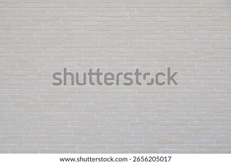 This structure showcases a light gray brick wall with a smooth surface. The design is modern and minimalistic, perfect for various aesthetic applications.