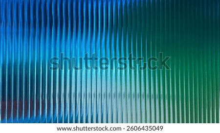 This stunning abstract image features smooth vertical lines in shades of blue and green, creating a visually striking gradient with a modern touch, perfect for various creative projects.