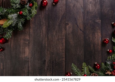 This stunning Christmas design features a stylish combination of bright red ornaments and green pine branches set against a textured dark wood background, perfect for holiday-themed designs.