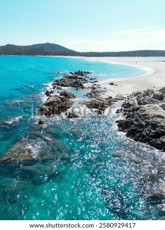 This stunning image captures a tranquil beach scene showcasing the expansive shoreline and the distant horizon