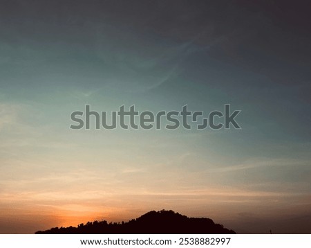 Similar – Image, Stock Photo The sun bids farewell in the background with a fantastic play of colors, and at the same time black clouds move across the land.