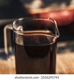 This stylish Glass Pitcher filled with Dark Liquid is Perfect for all Coffee Lovers out there - Powered by Shutterstock