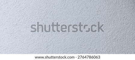 This surface displays a grainy texture that is suitable for background design. This texture works well for digital artwork, presentations, or any creative work needing a simple backdrop.